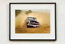Load image into Gallery viewer, &#39;Donut&#39; shows a classic American car donut driving on a Norfolk beach in the East of England. This photograph was captured at Hemsby Rock and Roll weekend, and is part of Richard Heeps&#39; Man&#39;s Ruin&#39; series.