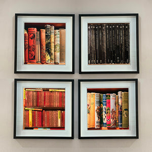 Set of four vintage book spines photographs framed in black by Richard Heeps.