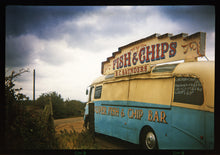 Load image into Gallery viewer, A moody Fenland sky is backdrop to a classic British Fish &amp; Chips Van. The typography and the van itself has a fun fairground feel, contrary to the muted tones of this piece. Part of Richard Heeps series, &#39;A View of the Fens from the Car with Wings&#39;.