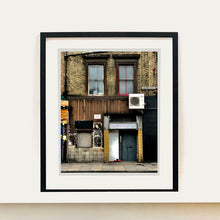 Load image into Gallery viewer, East London brick building architecture street photography by Richard Heeps framed in black.