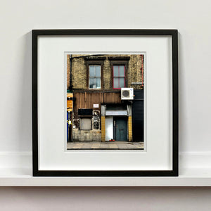East London brick building architecture street photography by Richard Heeps framed in black.
