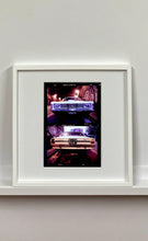 Load image into Gallery viewer,  A classic white Ford Taurus, photographed on the streets of Turro, Milan. 