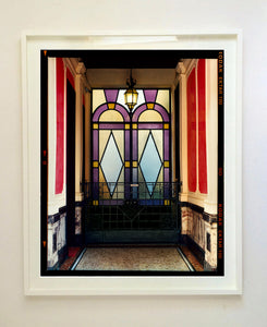 'Foyer VII' shows an Art Deco entrance hall in Milan, featuring stained glass panelling and marble flooring. This artwork is part of Richard Heeps' series 'A Short History of Milan', which began in November 2018 for a special project featuring at the Affordable Art Fair Milan 2019, and the series is ongoing. There is a reoccurring linear, structural theme throughout the series, capturing the Milanese use of materials in design such as glass, metal, wood and stone.