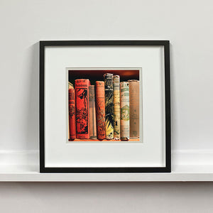 Framed photograph of vintage book spines by Richard Heeps.