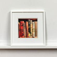 Load image into Gallery viewer, Framed photograph of vintage book spines by Richard Heeps.