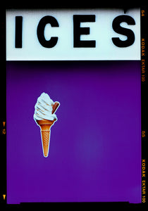 Photograph by Richard Heeps.  Black letters spell out ICES and below is depicted a 99 icecream cones sitting left of centre against a purple coloured background.  