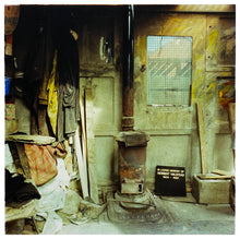 Load image into Gallery viewer, Photography by Richard Heeps.  Set in a workshop, the central piece is an old log burner.  Sitting on its right hand side is a grave stone in memory of Herbert Halstead.