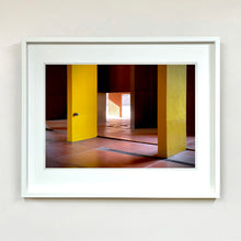 Load image into Gallery viewer, Monte Amiata housing, Gallaratese Quarter, Milan. Yellow brutalist architecture photograph by Richard Heeps framed in white.