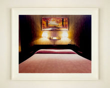 Load image into Gallery viewer, An ongoing subject of Richard&#39;s photography is the motel room. In this instance, photographed at the Lariat Motel in Fallon, Nevada. It is also often a significant location within American film and TV culture. For example, It is the backdrop for the iconic scene in the Hollywood film psycho. In this atmospheric image, the bed lights are joined together conveying a sense of coupling.