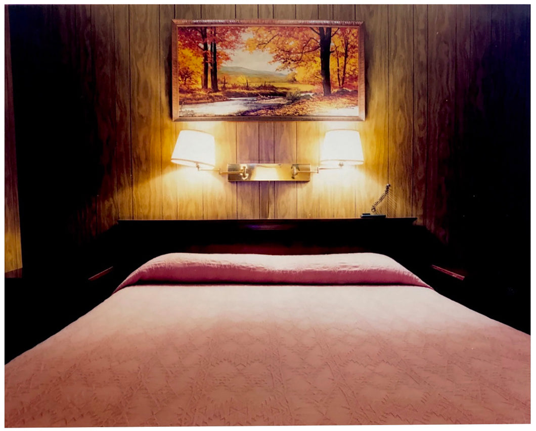 An ongoing subject of Richard's photography is the motel room. In this instance, photographed at the Lariat Motel in Fallon, Nevada. It is also often a significant location within American film and TV culture. For example, It is the backdrop for the iconic scene in the Hollywood film psycho. In this atmospheric image, the bed lights are joined together conveying a sense of coupling.