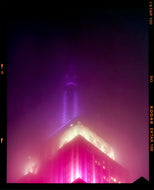 NOMAD I (Film Rebate), New York. Richard Heeps has photographed the iconic Empire State building in the mist. The NOMAD sequence of photographs capture the art deco architecture illuminated by changing colours, and is part of Richard's street photography portfolio which depict the colour, fabric and structure of cities with distinct style. This 6x7 format edition is bordered by the Kodak film rebate. 