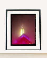 Load image into Gallery viewer, NOMAD VII (Film Rebate), New York, photography by Richard Heeps capturing the iconic Empire State building in the mist. Part of a sequence of photographs capturing the art deco architecture illuminated in changing colours. This 6x7 format edition is bordered by the Kodak film rebate. This artwork is part of Richard&#39;s portfolio of street photography he is building up which depict the colour, fabric and structure of cities with distinct style