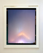 Load image into Gallery viewer, &#39;NOMAD VI (Film Rebate)&#39;, New York. Richard Heeps has photographed the iconic Empire State building in the mist. The NOMAD sequence of photographs capture the art deco architecture illuminated by changing colours, and is part of Richard&#39;s street photography portfolio which depict the colour, fabric and structure of cities with distinct style. This 6x7 format edition is bordered by the Kodak film rebate. 