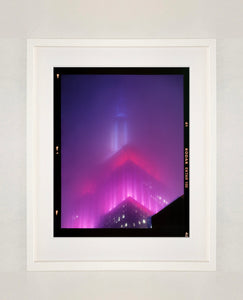 'NOMAD V (Film Rebate)', New York. Richard Heeps has photographed the iconic Empire State building in the mist. The NOMAD sequence of photographs capture the art deco architecture illuminated by changing colours, and is part of Richard's street photography portfolio which depict the colour, fabric and structure of cities with distinct style. This 6x7 format edition is bordered by the Kodak film rebate. 