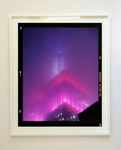 'NOMAD V (Film Rebate)', New York. Richard Heeps has photographed the iconic Empire State building in the mist. The NOMAD sequence of photographs capture the art deco architecture illuminated by changing colours, and is part of Richard's street photography portfolio which depict the colour, fabric and structure of cities with distinct style. This 6x7 format edition is bordered by the Kodak film rebate. 