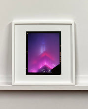 Load image into Gallery viewer, &#39;NOMAD V (Film Rebate)&#39;, New York. Richard Heeps has photographed the iconic Empire State building in the mist. The NOMAD sequence of photographs capture the art deco architecture illuminated by changing colours, and is part of Richard&#39;s street photography portfolio which depict the colour, fabric and structure of cities with distinct style. This 6x7 format edition is bordered by the Kodak film rebate. 
