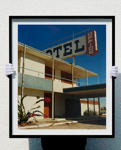 'North Shore Motel Office II' from Richard Heeps' 'Salton Sea' series. This artwork shows a deep blue sky over this Californian classic mid-century modern Americana Motel exterior. This photograph was captured by Richard Heeps in 2003 but only executed in his darkroom for the first time in Spring 2020.