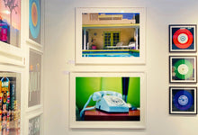 Load image into Gallery viewer, &#39;Telephone III, Ballantines Movie Colony&#39; is part of Richard Heeps&#39; &#39;Dream in Colour&#39; series. This cool Palm Springs interior artwork features a vintage telephone on a nightstand, combining gorgeous colours with a nostalgic mid-century feel.