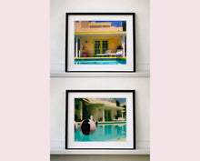 Load image into Gallery viewer, Part of Richard Heeps&#39; &#39;Dream in Colour&#39; Series, &#39;Beach Ball&#39; captures Palm Springs mid-century modern architecture behind a trio of pink and black beach balls. The stillness and the subtle colours combine to make a calming artwork with a seductive cinematic vibe.