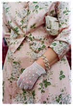 Load image into Gallery viewer, Photograph by Richard Heeps.  Vintage sophistication, a pink floral dress and matching coat, set off with crocheted white gloves.  Capturing the Goodwood revival vibe. 
