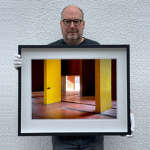 Load image into Gallery viewer, Monte Amiata housing, Gallaratese Quarter, Milan. Yellow brutalist architecture photograph by Richard Heeps framed in black.