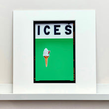 Load image into Gallery viewer, Mounted photograph by Richard Heeps.  At the top black letters spell out ICES and below is depicted a 99 icecream cone sitting left of centre against a green coloured background.  