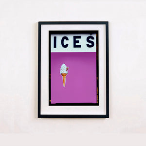 Black framed photograph by Richard Heeps.  At the top black letters spell out ICES and below is depicted a 99 icecream cone sitting left of centre against a plum coloured background.  