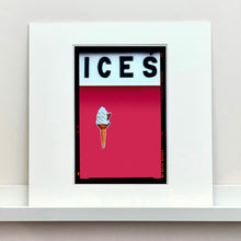 Load image into Gallery viewer, Mounted photograph by Richard Heeps.  At the top black letters spell out ICES and below is depicted a 99 icecream cone sitting left of centre against a raspberry coloured background.  