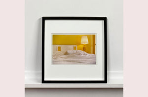 'Room' photographed by Richard Heeps at the mid-century Ballantines Move Colony in Palm Springs, California, shows a bright and bold yellow bedroom. This interior artwork is part of his 'Dream in Colour' series. 