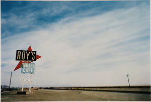 Part of the 'Dream in Colour' series, 'Roy's - Route 66' is one of Richard Heeps' classic American sign artworks featuring the road sign for Roy's Motel, which demonstrates historic Mid-Century Modern Googie architecture. This photograph was capture on the National Trails Highway of U.S. Route 66, in the Mojave Desert town of Amboy in San Bernardino County, California.