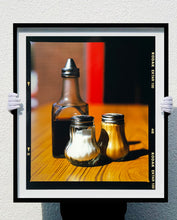 Load image into Gallery viewer, Salt, Pepper and Vinegar make up this still life photograph, taken in a Clacton-on-Sea cafe. It has been taken in true Richard Heeps style, showing beauty and interest in the ordinary and mundane.