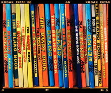 Load image into Gallery viewer, Photograph by Richard Heeps.  Multicolour Beano Annuals in a vintage bookshop in Burnham Market, Norfolk.