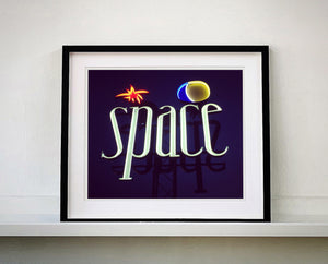 'Space', features neon lettering against an inky blue sky. The subject is a roadside sign taken in Ibiza during the final year of the iconic super club.