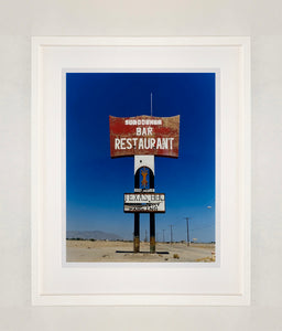 This giant isolated roadside sign set against a vast blue sky is a remnant of 'The Sundowner Bar and Restaurant' of the motel which is sadly no more. This photograph, part of Richard Heeps' 'Salton Sea' series captures the landscape of the western side of the lake.