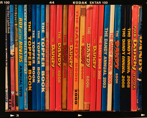 Multicolour vintage comic book spines photograph by Richard Heeps.