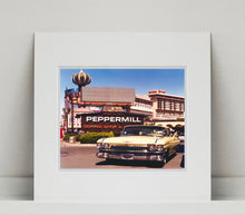 Load image into Gallery viewer, &#39;The Silver State&#39; was taken by Richard whilst at Viva Las Vegas 2001, where he was photographing for Classic American magazine. This photograph which shows a vintage car in front of a typical Las Vegas backdrop was chosen as the lead image for the magazine feature which focused on the iconic La Concha motel.