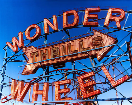 'Thrills', shot in Coney Island, new York. This iconic Wonder Wheel is a universal symbol of fun and will bring a sense of energy and excitement into any room. This artwork was selected for the 250th Royal Academy Summer Exhibition 2018.