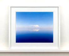 Load image into Gallery viewer, &#39;View from Bombay Beach&#39; looks over Salton Sea in California. Cooling shades of blue, reflection and symmetry are key to this serene waterscape. The suspended cloud which looks surreal creates a feeling of weightlessness. 