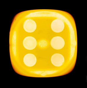 'Yellow Six', from Heidler & Heeps Dice Series, a yellow dice suspended on a black background.