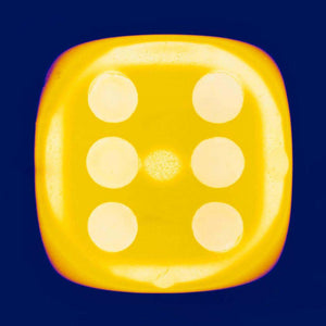 From Heidler & Heeps Dice Series, a yellow dice suspended on an inky blue background.