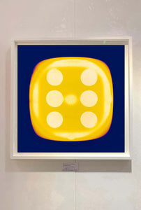 From Heidler & Heeps Dice Series, a yellow dice suspended on an inky blue background.