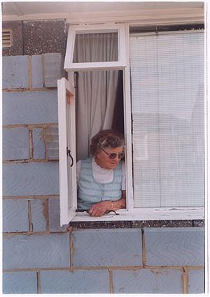 Mrs Swan at Window I, Post War Prefab, Wisbech 1993